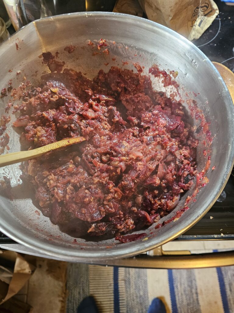 Mixing the beets, lentils, and onions together in a very large bowl